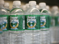 UNITED STATES - JULY 18:  Bottles of Poland Spring water, are arranged on a shelf in New York on Tuesday, July 18, 2006. Poland Spring, bottled at multiple sources in the state of Maine is Nestle's biggest and the No. 1 bottled water brand in the U.S. with sales of at least 500 million Swiss francs ($411) in 2004.  (Photo by Tom Starkweather/Bloomberg via Getty Images)